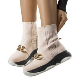 Botas isoladas bege com corrente Ulster