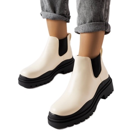 Botins bege em plataforma preta da Marinone