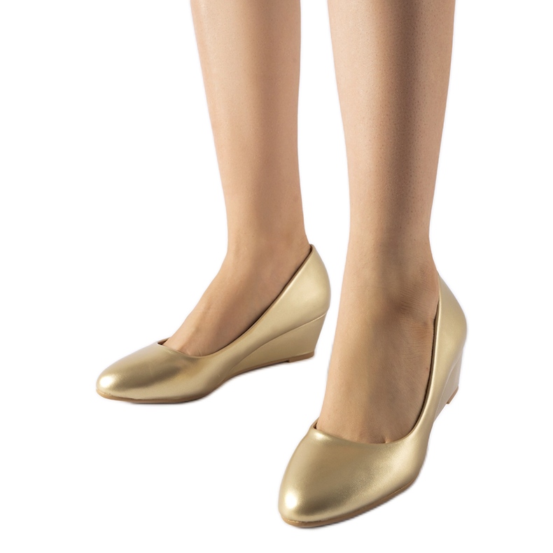 Sapatilhas douradas de cunha baixa de Houston dourado