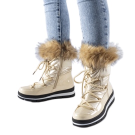 Botas de neve bege envernizadas com pele de arco
