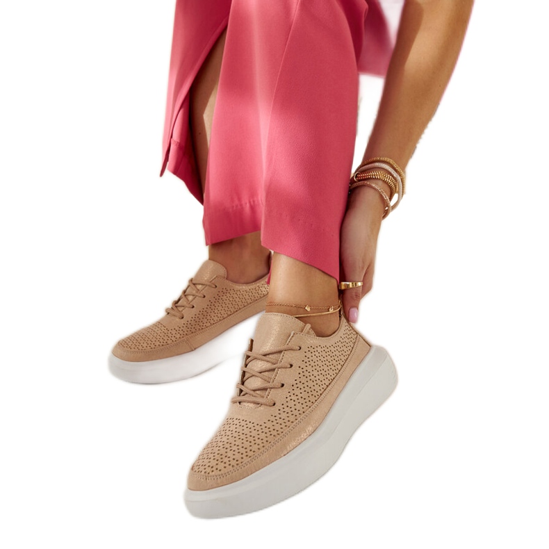 Tênis plataforma dourado de Lori