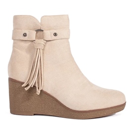 Botas femininas de camurça bege claro com franjas