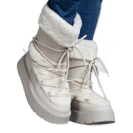 Botas de neve femininas com isolamento bege claro e decoradas com pele