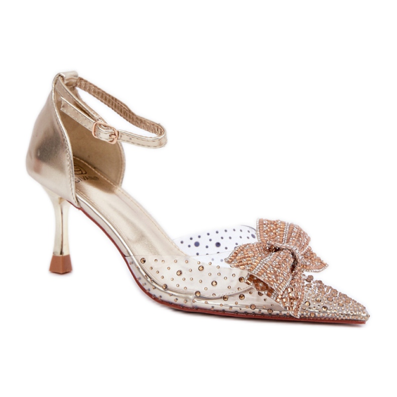 Salto alto feminino decorado com um impressionante laço dourado Salto alto feminino decorado com um impressionante laço dourado