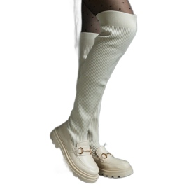 Botas bege claro com cano flexível e salto plano Botas bege claro com cano flexível e salto plano