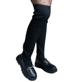Botas pretas com cano flexível e salto plano preto