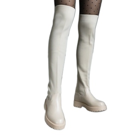 Botas bege claro com cano flexível e salto plano Botas bege claro com cano flexível e salto plano