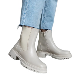Botins bege com isolamento e zíper, couro ecológico