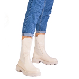 Botas bege com uma inserção de material