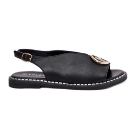 Sandálias planas elegantes com uma decoração negra preto