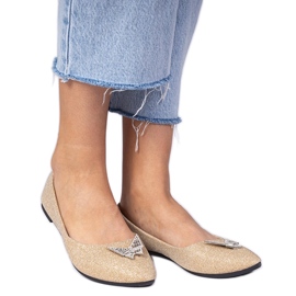 Ballerinas de glitter feminino dourado com uma borboleta Ballerinas de glitter feminino dourado com uma borboleta