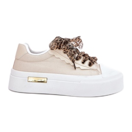 Tênis femininos em uma plataforma enorme com bêbado decorativo bege Tênis femininos em uma plataforma enorme com bêbado decorativo bege