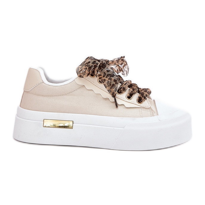 Tênis femininos em uma plataforma enorme com bêbado decorativo bege