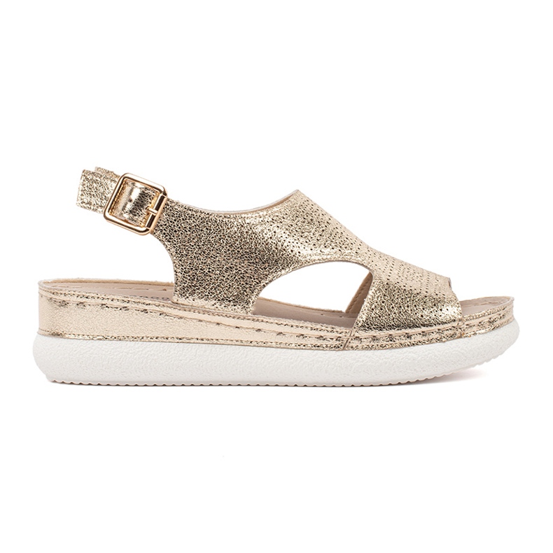 Goodin Sandálias de ouro em uma plataforma de luz dourado