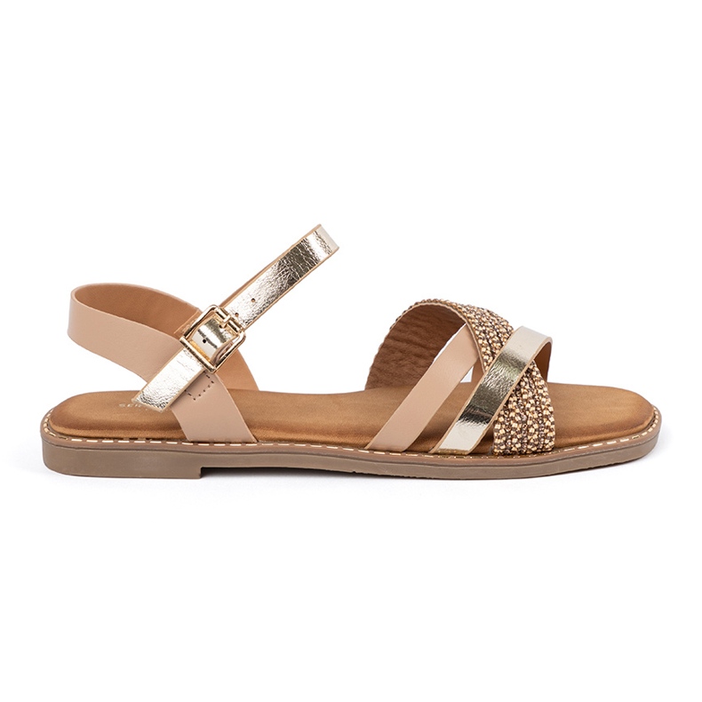 Sandálias femininas douradas em um sola plana Sergio Leone dourado