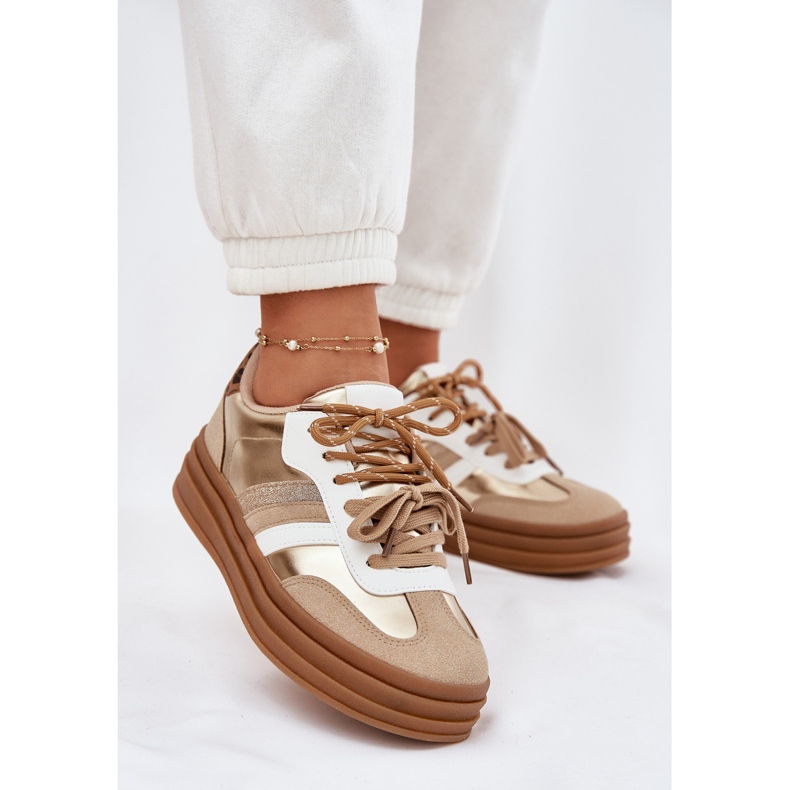 Tênis femininos na plataforma com o leopardo de laço duplo dourado