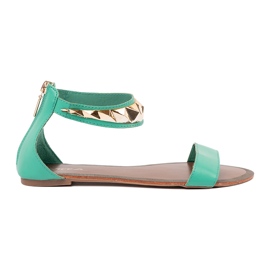 Sandálias verdes com um cinto de tornozelo com uma decoração de ouro Sandálias verdes com um cinto de tornozelo com uma decoração de ouro