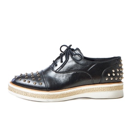 Sapatos femininos negros com pregos de grés preto Sapatos femininos negros com pregos de grés preto
