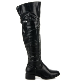 Botas pretas acima do joelho preto