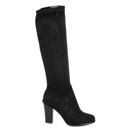 Botas de camurça no poste preto Botas de camurça no poste preto