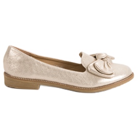 Forever Folie Bailarina de ouro com um arco dourado