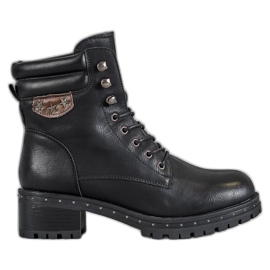 SHELOVET Botas militares em um poste preto