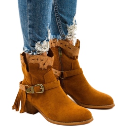 Botas de camurça marrom de geração no espigão