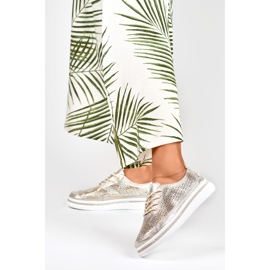 Sapatos desportivos dourados de mulher em pele genuína 2