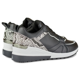 Sapatos de mulher pretos com atacadores e cunha baixa 1