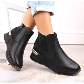 Tênis feminino de couro Rieker preto com cunha 1