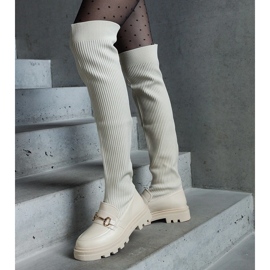 Botas bege claro com cano flexível e salto plano 1