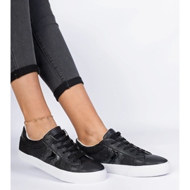 Tênis negros com um motivo animal decorado com glitter preto 2