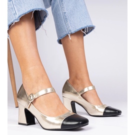 Bombas femininas douradas com nariz preto dourado 1