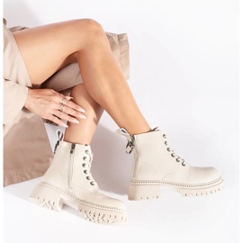 Botins femininos em pele bege com atacadores 1