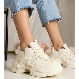 Esportes enormes femininos de tênis bege 1